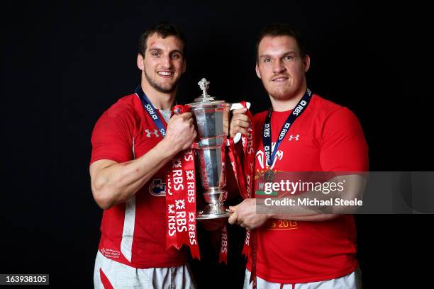 Flanker Sam Warburton and prop Gethin Jenkins of Wales pose with the Six Nations trophy following his team's victory during the RBS Six Nations match...