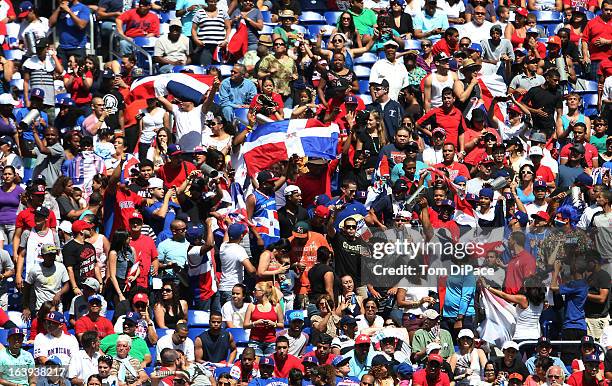 Dominican Republic fans celebrate during Pool 2, Game 6 against Team Puerto Rico in the second round of the 2013 World Baseball Classic on Saturday,...