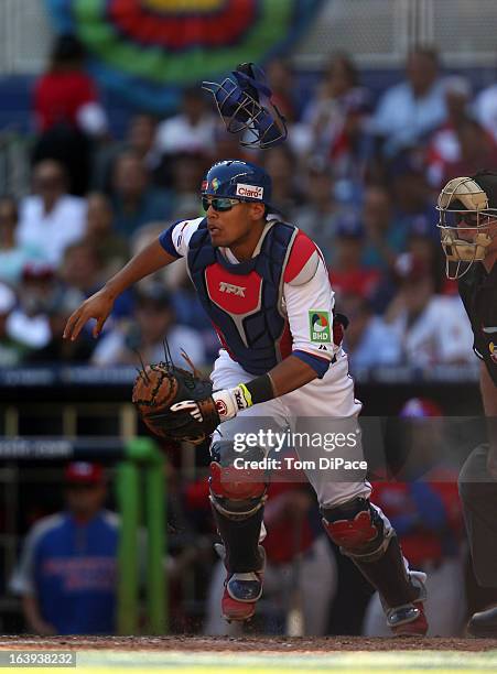 Francisco Pena of Team Dominican Republic attempts to field a sacrifice bunt during Pool 2, Game 6 against Team Puerto Rico in the second round of...