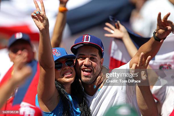 Dominican Republic fans celebrate during Pool 2, Game 6 against Team Puerto Rico in the second round of the 2013 World Baseball Classic on Saturday,...