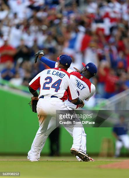 Fernando Rodney and Robinson Cano of Team Dominican Republic celebrate defeating Team Puerto Rico in Pool 2, Game 6 in the second round of the 2013...