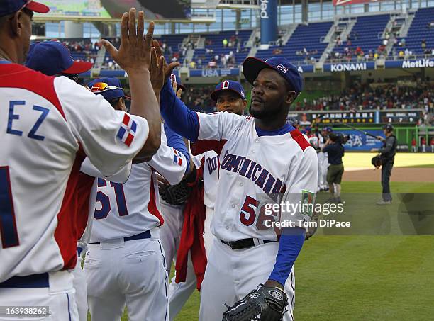 Fernando Rodney of Team Dominican Republic celebrate with teammates after defeating Team Puerto Rico in Pool 2, Game 6 in the second round of the...