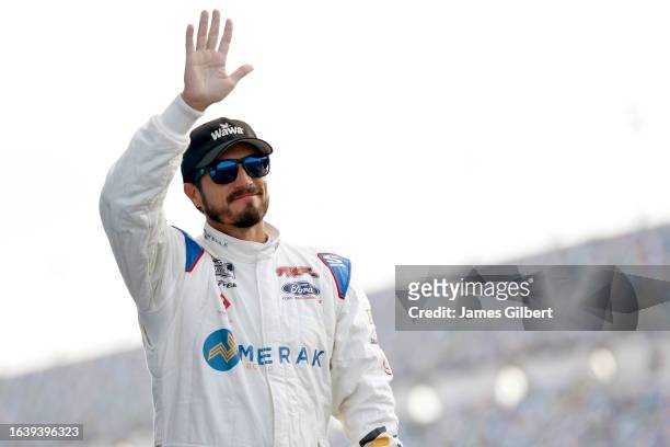 Yeley, driver of the Wawa Rechargers Chevrolet, waves to fans as he walks onstage during driver intros prior to the NASCAR Xfinity Series Wawa 250...