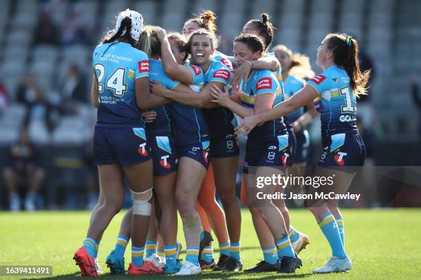 Lauren Brown of the Titans celebrates kicking the match winning field goal with teammates during the round six NRLW match between St George Illawarra...