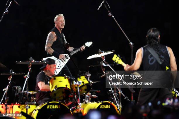 Lars Ulrich, James Hetfield and Robert Trujillo of Metallica perform onstage at SoFi Stadium on August 25, 2023 in Inglewood, California.