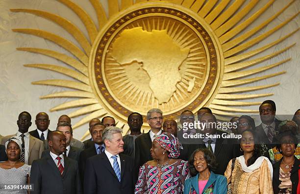 German President Joachim Gauck poses for a group photo with delegates of the African Union , including Chairwoman Nkosazana Dlamini-Zuma , after he...