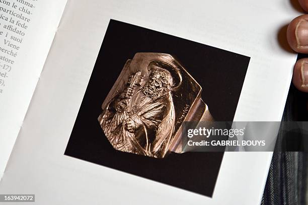 The Fisherman’s Ring of Pope Francis is seen on the Vatican's guide book for the inauguration mass on March 18, 2013 at the Vatican. Pope Francis has...