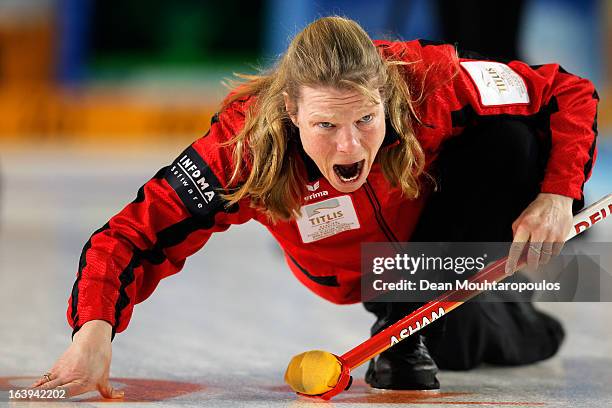 Andrea Schopp of Germany screams to her team mates after she releases the stone in the match between Japan and Germany during Day 3 of the Titlis...