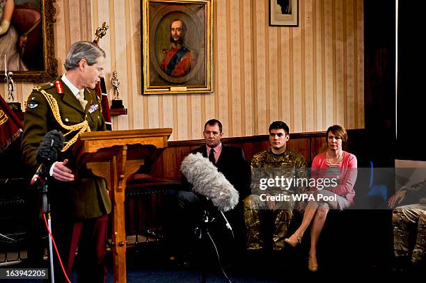 Commander Land Forces Lieutenant Adrian Bradshaw speaks at a press conference at Buller Barracks, as the family of Lance Corporal James Ashworth look...