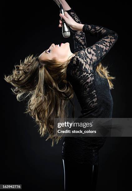 woman singing - pop musician stock pictures, royalty-free photos & images