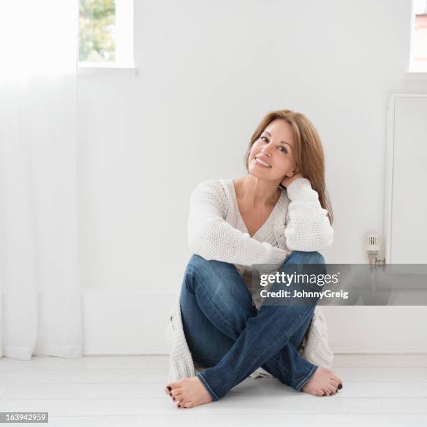 relaxed casual portrait of attractive woman - sitting on ground stock pictures, royalty-free photos & images