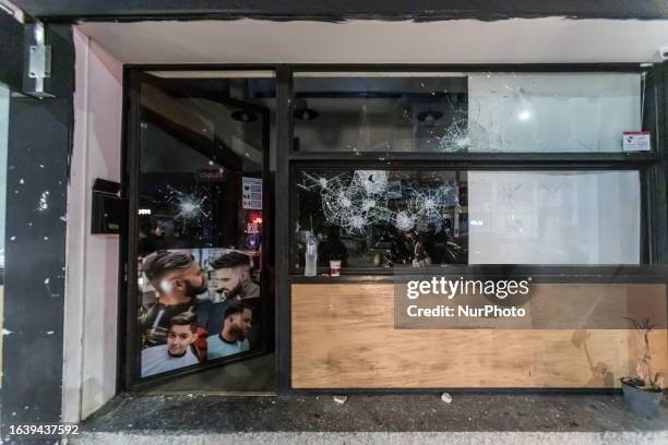 The front glass of the store is seen shattered, as protesters attacked the hair salon that belongs to a migrant, Limassol, Cyprus, on Sep. 2, 2023....