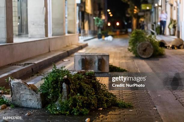 Broken pot holders are seen after the protest at Anexartisias street, one of the most commercial streets of the city, Limassol, Cyprus, on Sep. 2,...