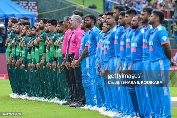 Pakistan's and India's players stand for national anthems before the start of the Asia Cup 2023 one-day international cricket match between India and...