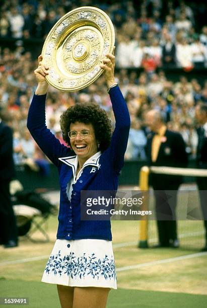 Billie Jean King of the USA holds the trophy aloft after the Lawn Tennis Championships at Wimbledon in London. King won the Women's Singles event. \...