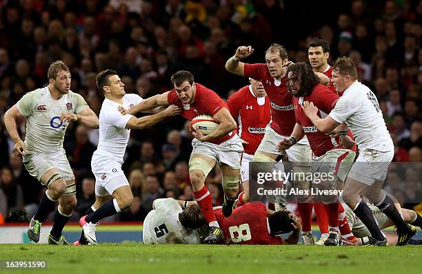 Flanker Sam Warburton of Wales hands off Danny Care of England whilst making a break during the RBS Six Nations match between Wales and England at...