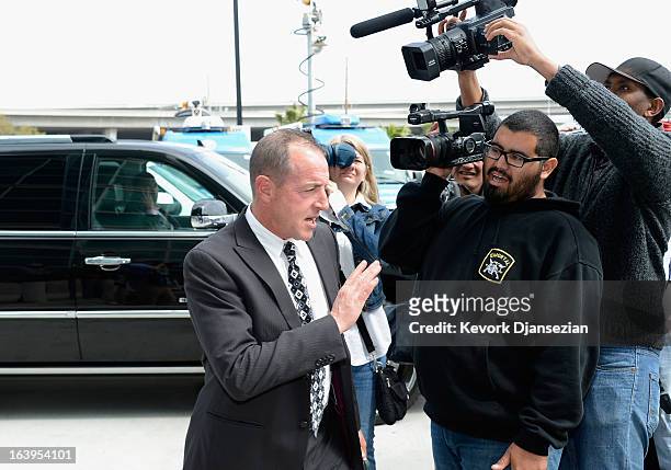 Michael Lohan, father of Lindsay Lohan, avoids the photographers as he leaves after Lohan's trial for allegedly lying to police after a car crash,...