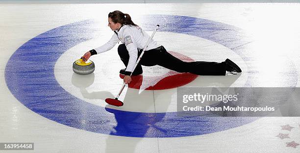 Emma Miskew of Canada throws the stone in the match between Canada and USA during Day 3 of the Titlis Glacier Mountain World Women's Curling...