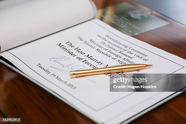 New Zealand Foreign Affairs Minister Murray McCully's signature is seen in a book to mark the wreath-laying ceremony acknowledging both Afghan and...