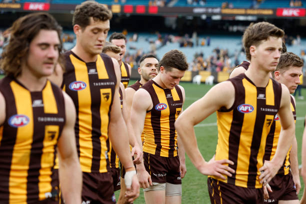 Disappointed Hawthorn players walk off the ground after the round 24 AFL match between Hawthorn Hawks and Fremantle Dockers at Melbourne Cricket...