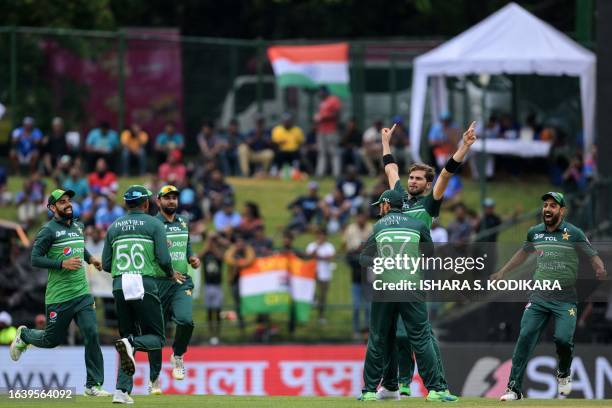 Pakistan's Shaheen Shah Afridi celebrates with teammates after taking the wicket of India's captain Rohit Sharma during the Asia Cup 2023 one-day...