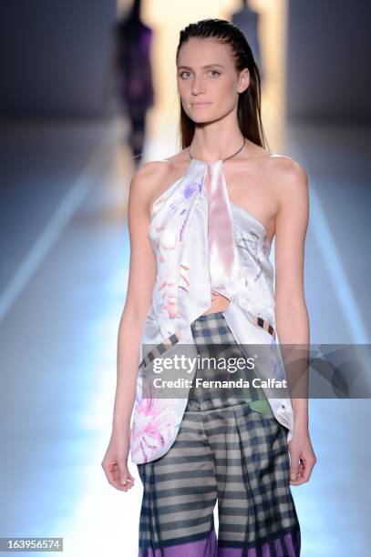 Model walks the runway during the Animale show during Sao Paulo Fashion Week Summer 2013/2014 on March 18, 2013 in Sao Paulo, Brazil.