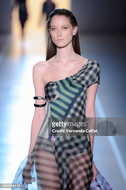 Model walks the runway during the Animale show during Sao Paulo Fashion Week Summer 2013/2014 on March 18, 2013 in Sao Paulo, Brazil.