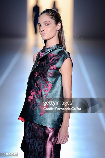 Model walks the runway during the Animale show during Sao Paulo Fashion Week Summer 2013/2014 on March 18, 2013 in Sao Paulo, Brazil.