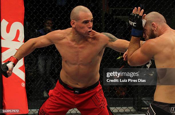 Daniel "Gelo" Oliveira punches Marcio "Pedra" Santos in their elimination fight during filming of season two of The Ultimate Fighter Brazil on...