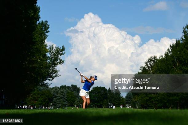 Momoko Ueda of Japan hits her third shot on the 9th hole during the third round of NITORI Ladies at Otaru Country Club on August 26, 2023 in Otaru,...