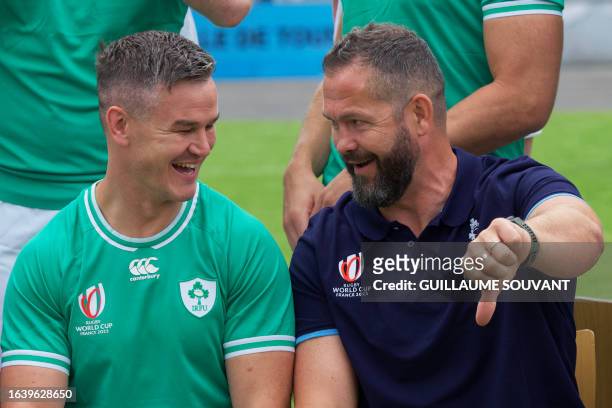 Ireland's head coach Andy Farrell jokes with Ireland's Captain and fly-half Jonathan Sexton smiles during a training session at the Stade de la...