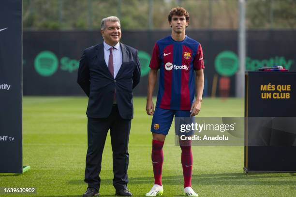 Portuguese forward Joao Felix and FC Barcelona President Joan Laporta are seen during Felix's official presentation as FC Barcelona player at the...