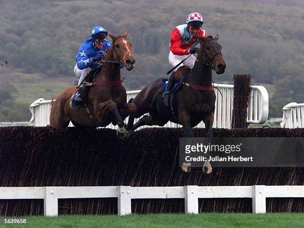 Richard Dunwoody and Village King leads Graham Bradley ridding River Dawn over the last fence before going on to win ''The Racing Channel Available...