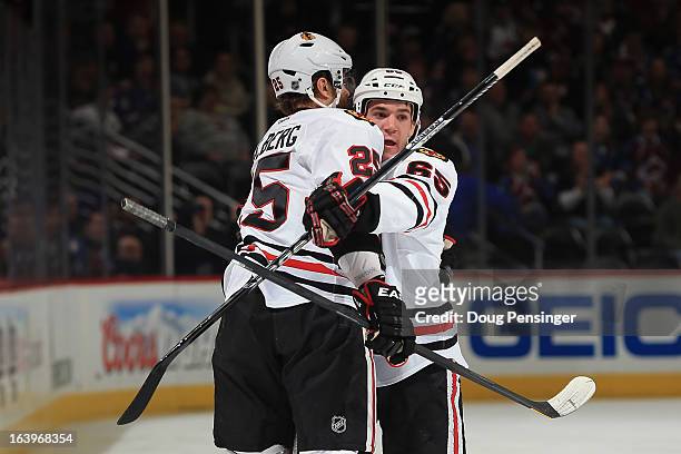 Andrew Shaw of the Chicago Blackhawks celebrates his first period goal with Viktor Stalberg of the Chicago Blackhawks as they take a 2-0 lead over...