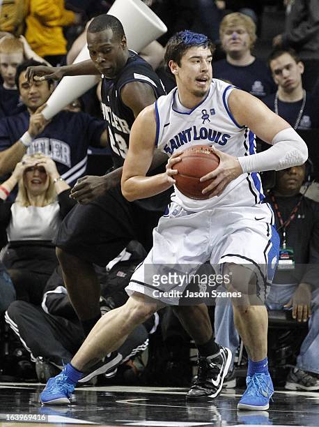 Cody Ellis of the St. Louis Billikens handles the ball against Khyle Marshall of the Butler Bulldogs in the second half during the Atlantic 10...