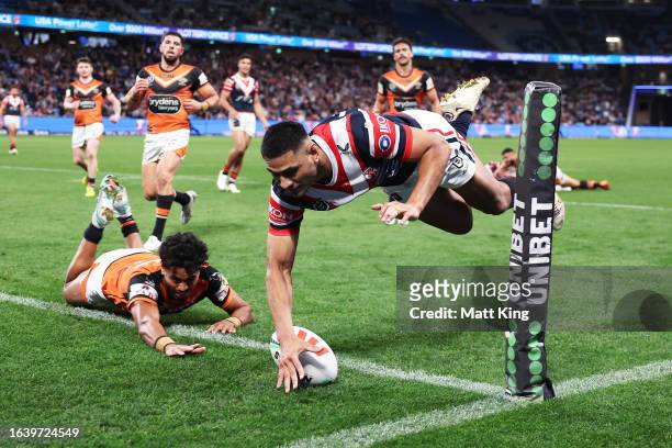 Daniel Tupou of the Roosters scores a try during the round 26 NRL match between Sydney Roosters and Wests Tigers at Allianz Stadium on August 26,...