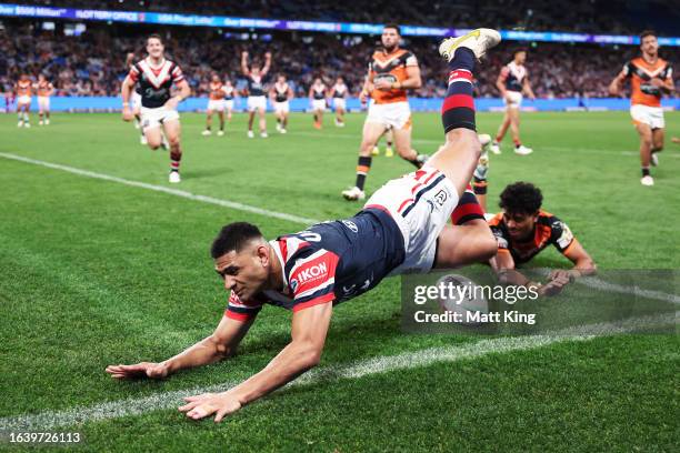 Daniel Tupou of the Roosters scores a try during the round 26 NRL match between Sydney Roosters and Wests Tigers at Allianz Stadium on August 26,...