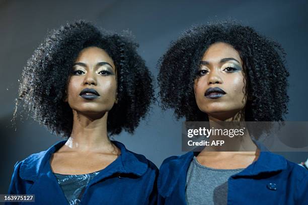 Year-old twin models of Cavalera pose before their show during the 2013 Summer collections of the Sao Paulo Fashion Week in Sao Paulo, Brazil, on...
