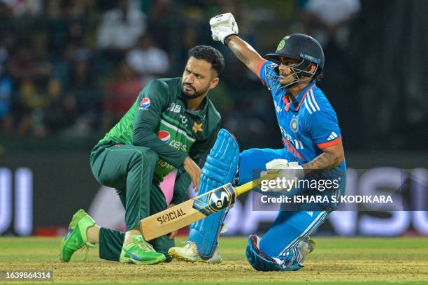 India's Ishan Kishan falls on the ground during the Asia Cup 2023 one-day international cricket match between India and Pakistan at the Pallekele...