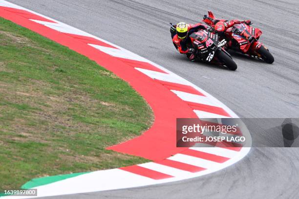 Aprilia Spanish rider Aleix Espargaro competes against Ducati Italian rider Francesco Bagnaia during the MotoGP sprint race of the Catalunya Moto...
