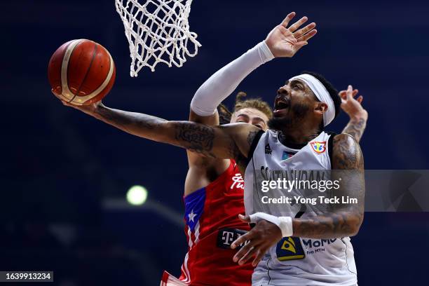 Carlik Jones of South Sudan drives to the basket against Isaiah Pineiro of Puerto Rico in overtime during the FIBA Basketball World Cup Group B game...