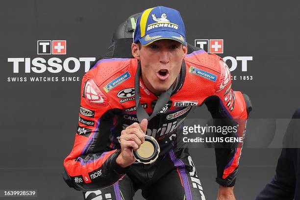 Winner Aprilia Spanish rider Aleix Espargaro celebrates on the podium winning the MotoGP sprint race of the Catalunya Moto Grand Prix at the Circuit...