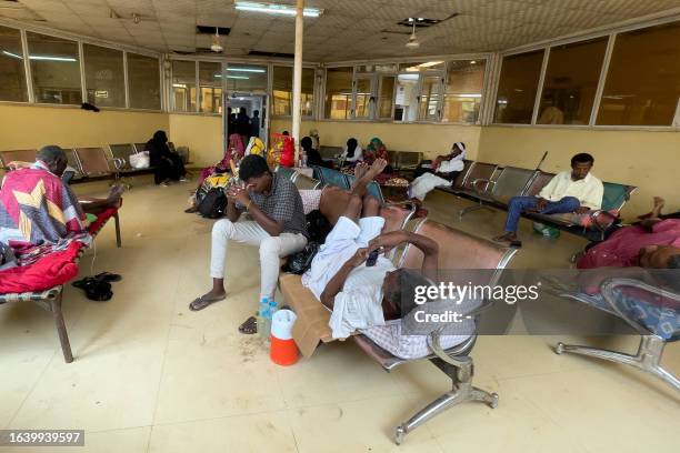 Patients wait for treatment at the Gezira Hospital in Wad Madani on September 2, 2023. The conflict which erupted on April 15 has prevented victims...