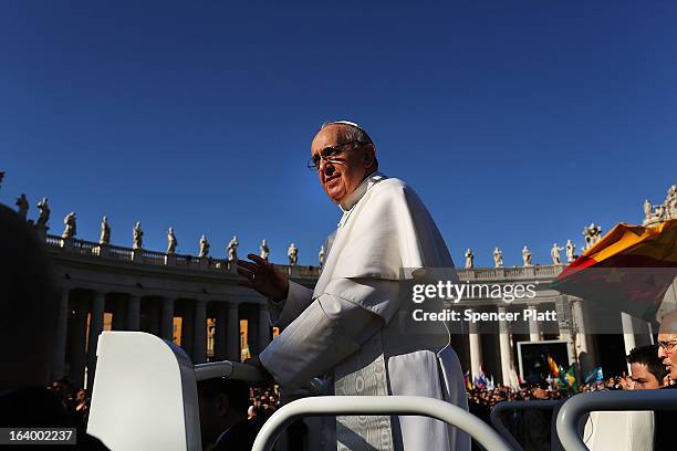 Pope Francis drives through the crowds during the Inauguration Mass for the Pope in St Peter's Square on March 19, 2013 in Vatican City, Vatican. The...