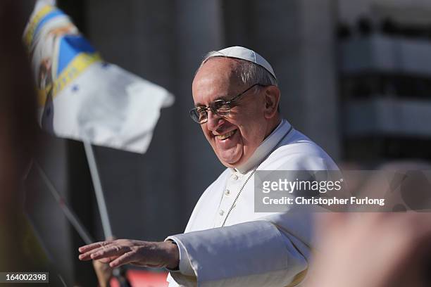 Pope Francis greets the faithful during the Inauguration Mass for Pope Francis in St Peter's Square on March 19, 2013 in Vatican City, Vatican. The...