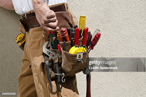 handyman with tool belt - tool belt stock pictures, royalty-free photos & images