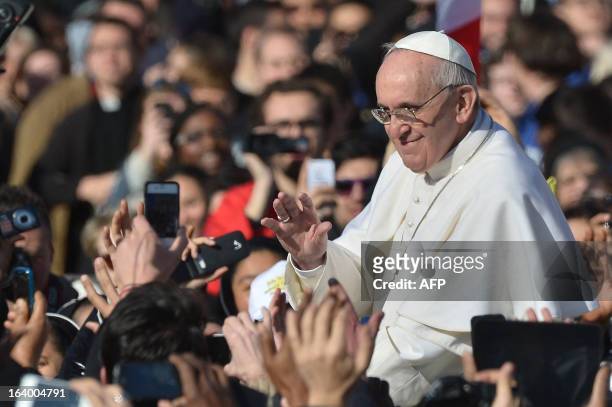 Pope Francis waves from the papamobile during his inauguration mass at St Peter's square on March 19, 2013 at the Vatican. World leaders flew in for...