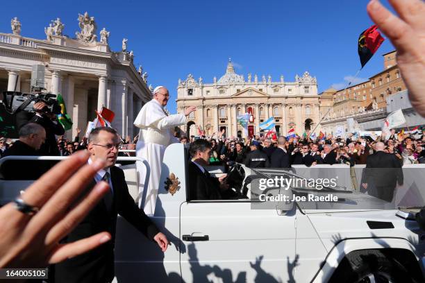 Pope Francis arrives in the Pope Mobile for his Inauguration Mass in St Peter's Square on March 19, 2013 in Vatican City, Vatican. The mass is being...