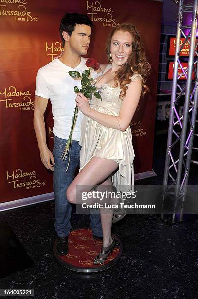 Georgina Fleur poses with the Taylor Lautner wax figure as it is unveiled at Madame Tussauds Berlin on March 19, 2013 in Berlin, Germany.