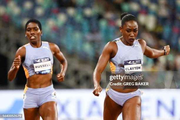 Jamaica's Rushell Clayton wins ahead of Jamaica's Janieve Russell coming in third in the women's 400m hurdles final during the IAAF Diamond League...